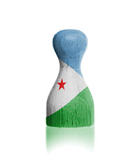 Image showing Wooden pawn with a flag painting