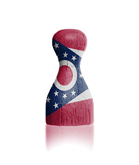 Image showing Wooden pawn with a painting of a flag