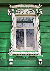 Image showing Window with white trim on the green wall