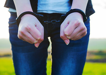 Image showing Woman with handcuffed hands