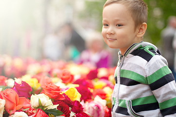 Image showing Little Boy With Easter Eggs And Flowers