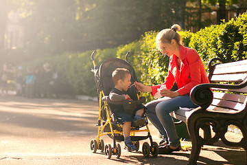 Image showing Mother Feeding Her Son