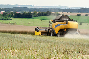 Image showing combine harvesting rape