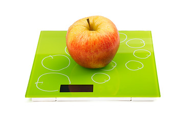 Image showing Red apple on scales