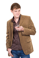 Image showing Handsome man posing with a glass of whiskey