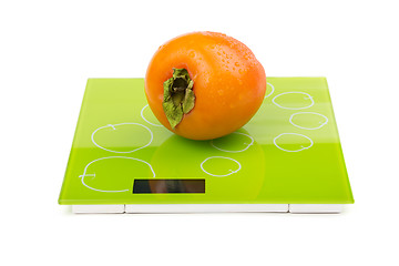 Image showing Persimmon on square scales