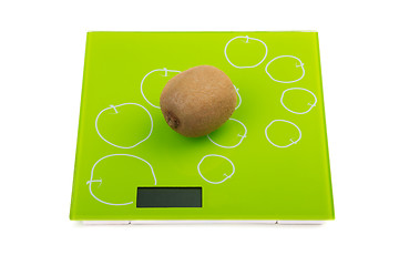 Image showing Kiwi fruit on kitchen scales