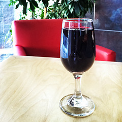Image showing Glass of red wine on the table