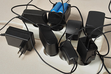 Image showing Battery chargers and extension cord
