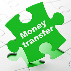 Image showing Business concept: Money Transfer on puzzle background