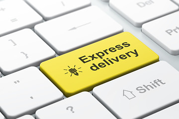 Image showing Business concept: Energy Saving Lamp and Express Delivery on computer keyboard background