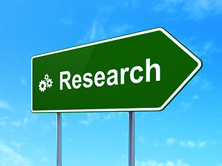 Image showing Advertising concept: Research and Gears on road sign background