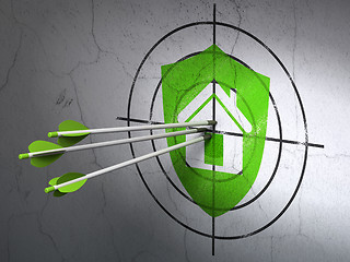 Image showing Business concept: arrows in Shield target on wall background