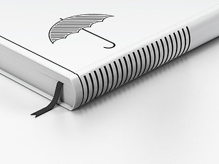 Image showing Security concept: closed book, Umbrella on white background