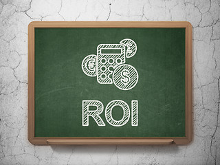 Image showing Business concept: Calculator and ROI on chalkboard background