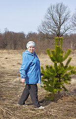 Image showing Elderly beautiful woman in a spring forest