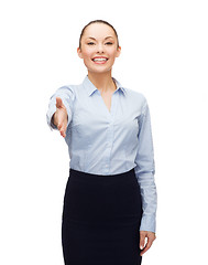 Image showing businesswoman with opened hand ready for handshake