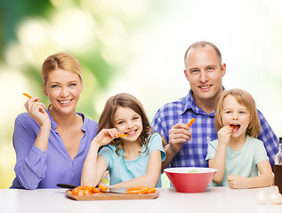 Image showing happy family with two kids eating at home