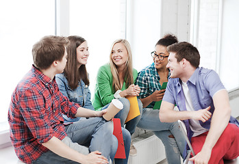 Image showing students communicating and laughing at school