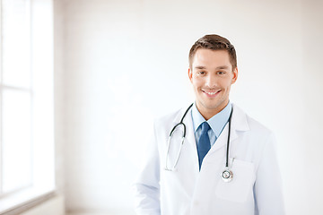 Image showing young male doctor with stethoscope in hospital