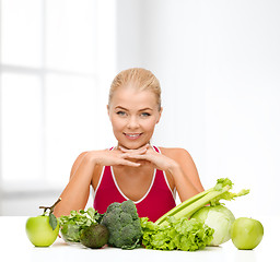 Image showing smiling sporty woman with organic food