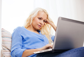 Image showing woman with laptop computer at home