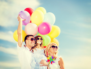 Image showing family with colorful balloons