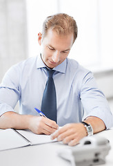 Image showing handsome businessman working in the office