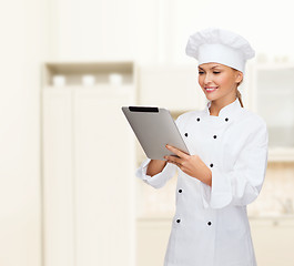 Image showing smiling female chef with tablet pc computer