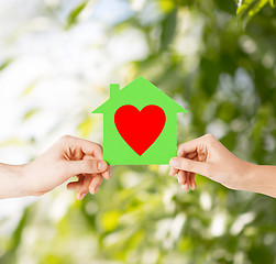 Image showing couple hands holding green paper house