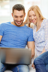 Image showing smiling happy couple with laptop at home