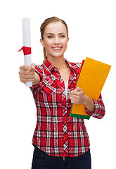 Image showing smiling woman with diploma and folders