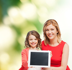 Image showing smiling mother and daughter with tablet pc