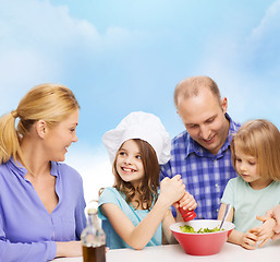 Image showing happy family with two kids eating at home