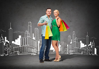 Image showing smiling couple with shopping bags