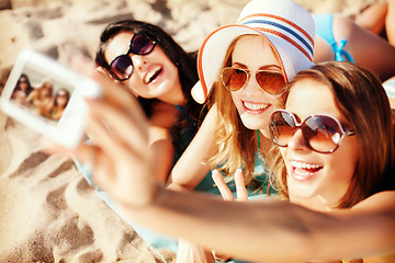 Image showing girls making self portrait on the beach