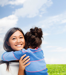 Image showing hugging mother and daughter