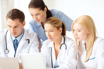 Image showing group of doctors with laptop and tablet pc