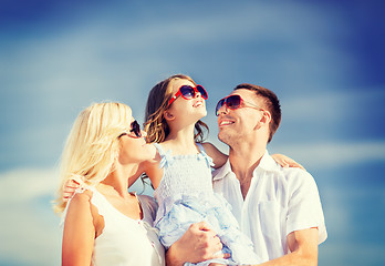 Image showing happy family with blue sky