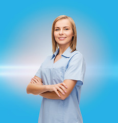 Image showing smiling female doctor or nurse