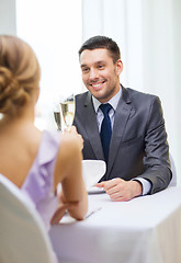 Image showing couple with glasses of champagne at restaurant