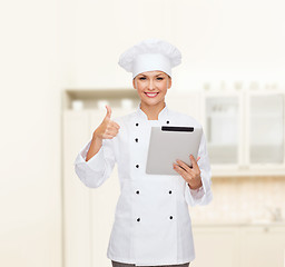 Image showing smiling female chef with tablet pc computer