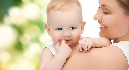 Image showing happy mother with adorable baby