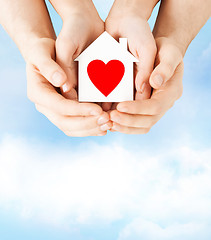 Image showing couple hands holding white paper house