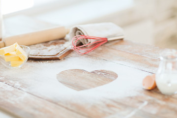 Image showing close up of heart of flour on wooden table at home