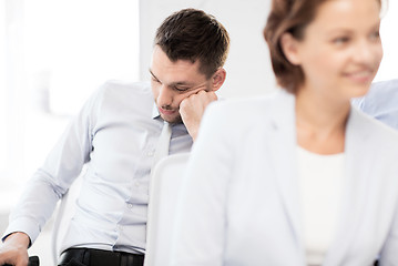 Image showing tired businessmen sleeping on conference