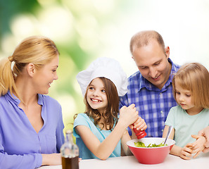 Image showing happy family with two kids eating at home