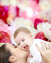 Image showing laughing baby playing with mother