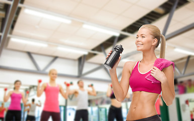 Image showing sporty woman drinking water from sportsman bottle