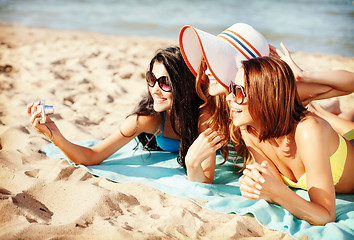 Image showing girls making self portrait on the beach